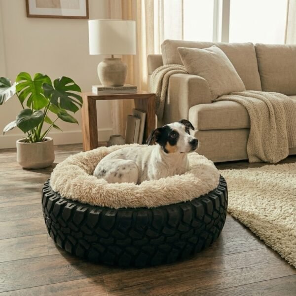 Fox Teria sleeping comfortably in Treads2Tails upcycled tyre dog bed with grey indoor luxury faux fur